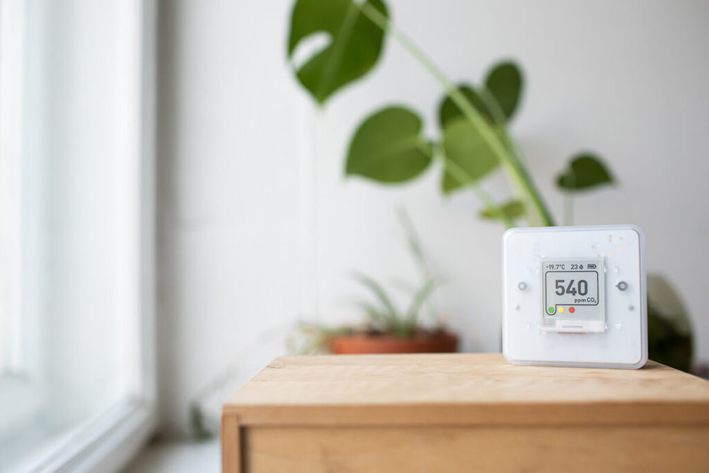Carbon monoxide meter next to indoor plant